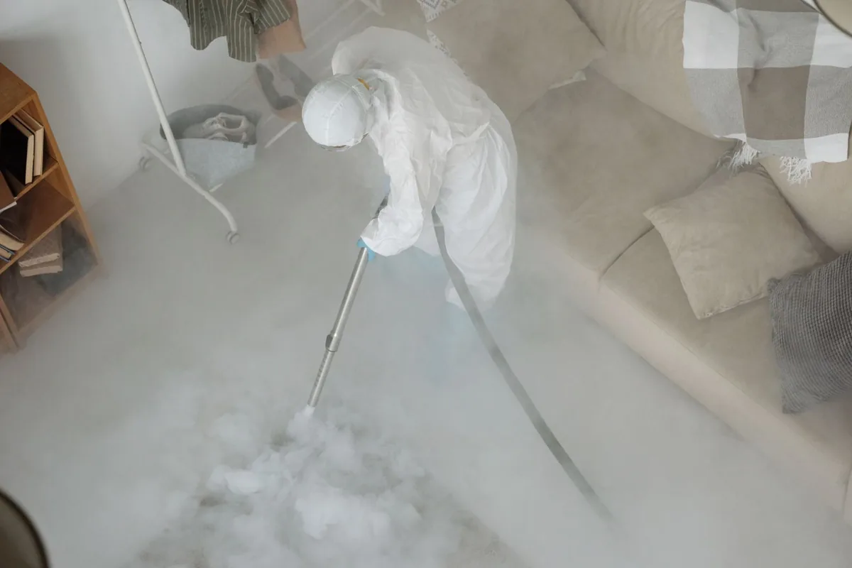 Biohazard cleanup technician in protective equipment, Wheaton, MN